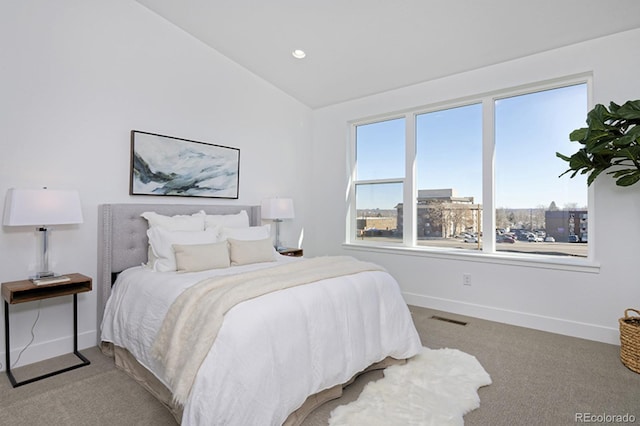 carpeted bedroom with recessed lighting, baseboards, vaulted ceiling, and visible vents