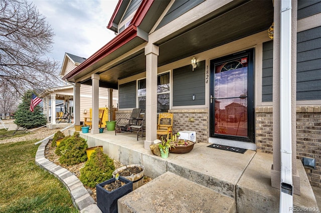 1824 Asoka St, Strasburg, CO 80136 - view of exterior entry featuring covered porch