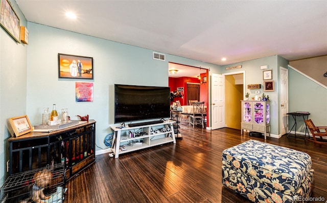 1824 Asoka St, Strasburg, CO 80136 - living room with wood finished floors, recessed lighting, and baseboards