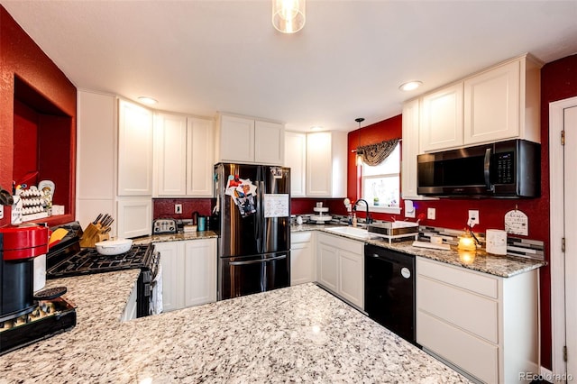 1824 Asoka St, Strasburg, CO 80136 - kitchen with black appliances, a sink, light stone countertops, white cabinets, and recessed lighting