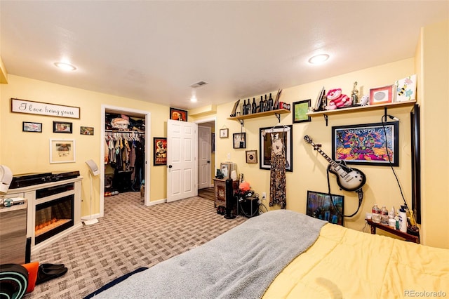 1824 Asoka St, Strasburg, CO 80136 - bedroom with carpet, a walk in closet, baseboards, a closet, and recessed lighting