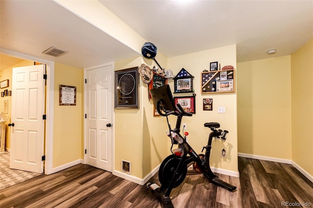 1824 Asoka St, Strasburg, CO 80136 - workout area with dark wood finished floors and baseboards