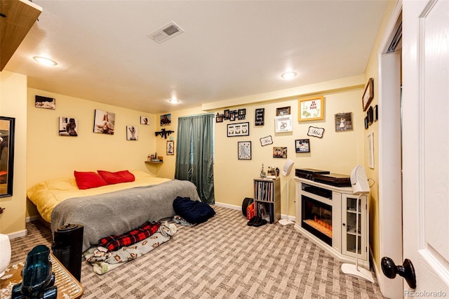 1824 Asoka St, Strasburg, CO 80136 - carpeted bedroom featuring baseboards, recessed lighting, and a glass covered fireplace
