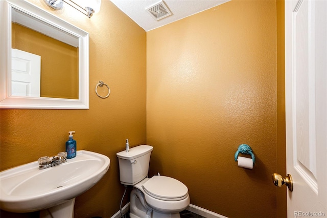 1824 Asoka St, Strasburg, CO 80136 - half bathroom featuring a sink and toilet