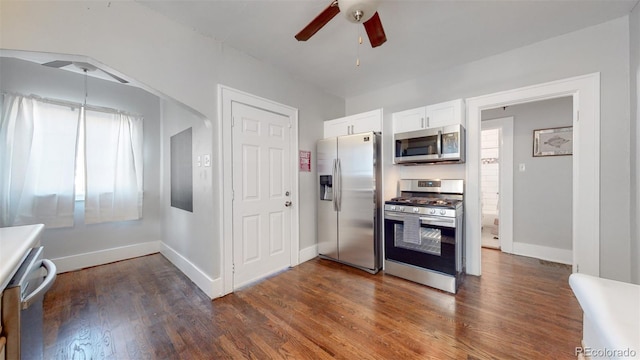 kitchen featuring white cabinets, dark hardwood / wood-style floors, ceiling fan, and appliances with stainless steel finishes