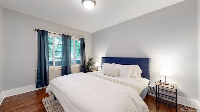 bedroom featuring dark hardwood / wood-style floors