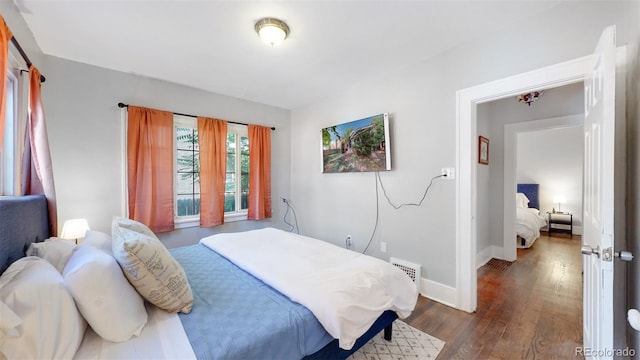 bedroom featuring dark hardwood / wood-style floors