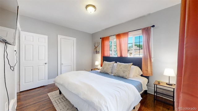 bedroom featuring dark hardwood / wood-style floors