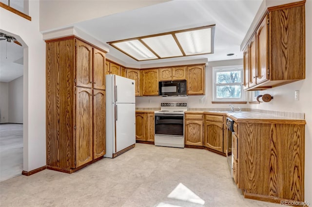 kitchen featuring sink and black appliances