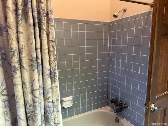 bathroom featuring shower / bathtub combination with curtain