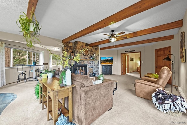 13540 Deer Ridge Way, Larkspur, CO 80118 - carpeted living room with beamed ceiling, a stone fireplace, a textured ceiling, and ceiling fan