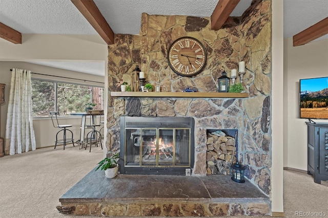 13540 Deer Ridge Way, Larkspur, CO 80118 - detailed view of beamed ceiling, carpet floors, a stone fireplace, and a textured ceiling