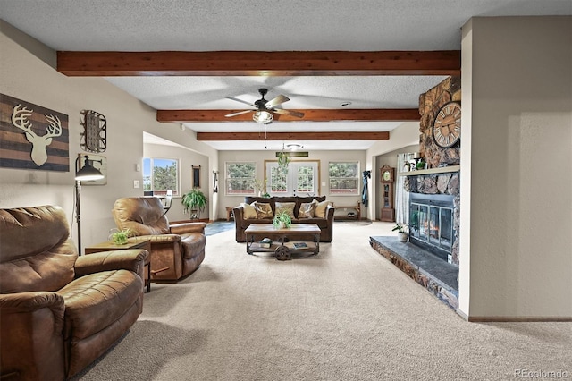 13540 Deer Ridge Way, Larkspur, CO 80118 - carpeted living area with a fireplace, beamed ceiling, ceiling fan, and a textured ceiling