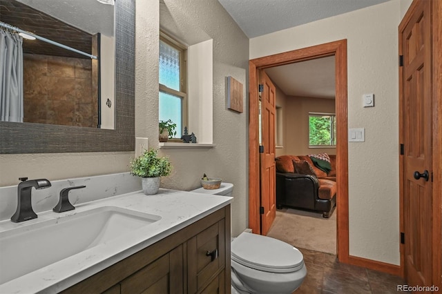 13540 Deer Ridge Way, Larkspur, CO 80118 - ensuite bathroom with a textured wall, vanity, and a shower with curtain