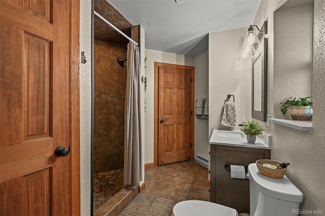 13540 Deer Ridge Way, Larkspur, CO 80118 - bathroom with a shower stall, a baseboard heating unit, vanity, a textured ceiling, and a textured wall