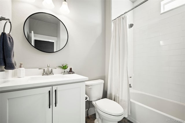 full bathroom with shower / bath combo, vanity, and toilet