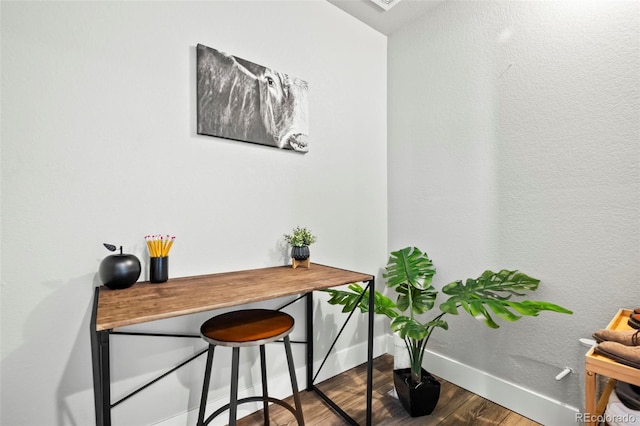 office space with wood-type flooring