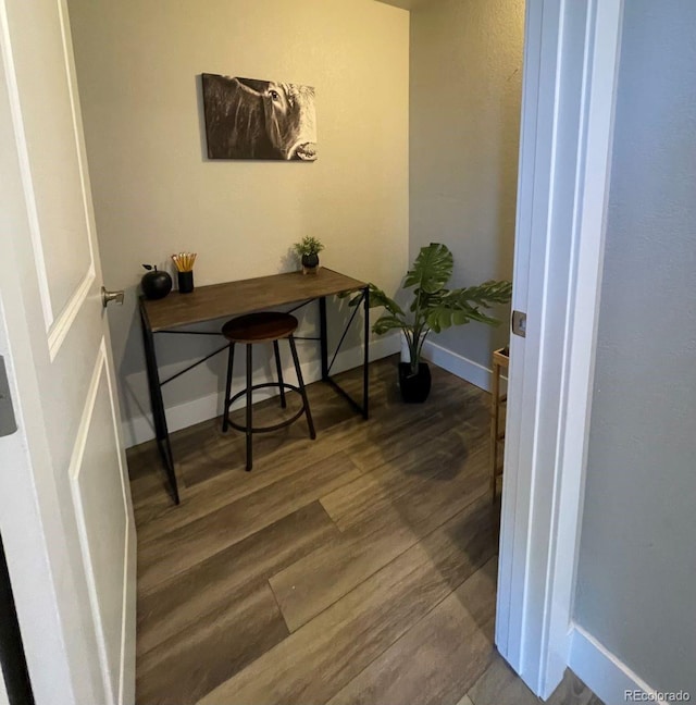 office with dark hardwood / wood-style floors