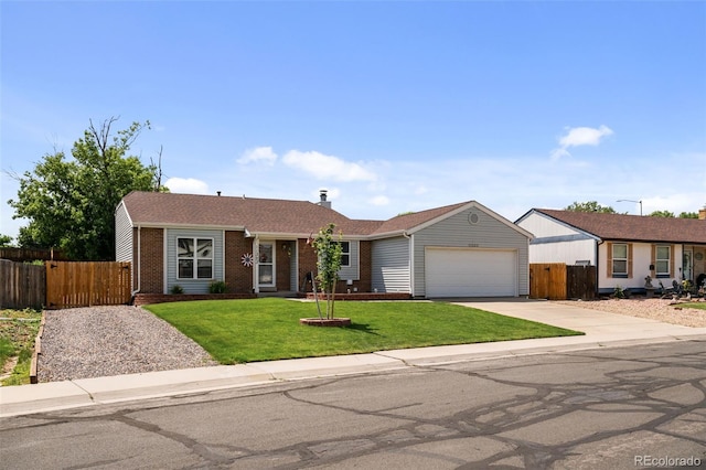 11323 Albion St, Thornton, CO 80233 - ranch-style home with brick siding, concrete driveway, and a garage