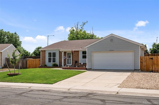 11323 Albion St, Thornton, CO 80233 - ranch-style house featuring an attached garage, concrete driveway, and brick siding