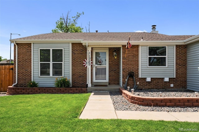 11323 Albion St, Thornton, CO 80233 - view of front of house with brick siding and a shingled roof