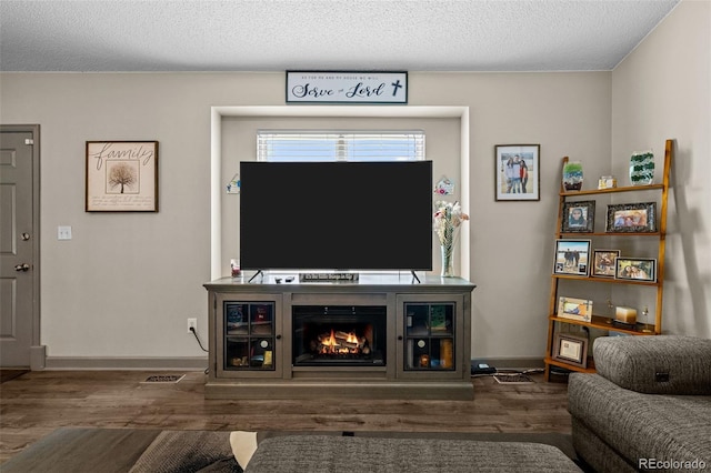 11323 Albion St, Thornton, CO 80233 - living area with wood finished floors and a warm lit fireplace