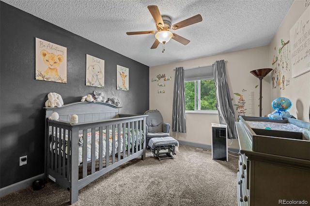 11323 Albion St, Thornton, CO 80233 - bedroom with a textured ceiling, carpet flooring, a crib, and ceiling fan