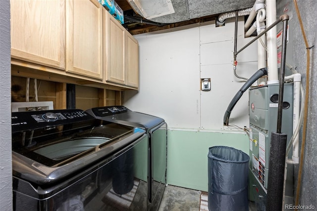 11323 Albion St, Thornton, CO 80233 - laundry room featuring washing machine and clothes dryer, cabinet space, and heating unit