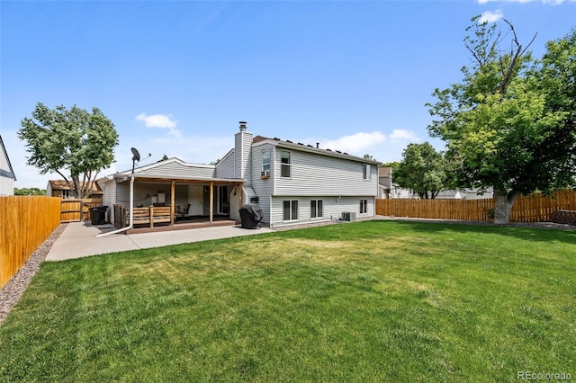 11323 Albion St, Thornton, CO 80233 - back of property featuring a patio area, a fenced backyard, and a chimney
