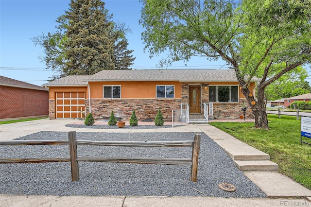 3107 S Wolff St, Denver, CO 80236 - single story home with stucco siding, a garage, driveway, and stone siding