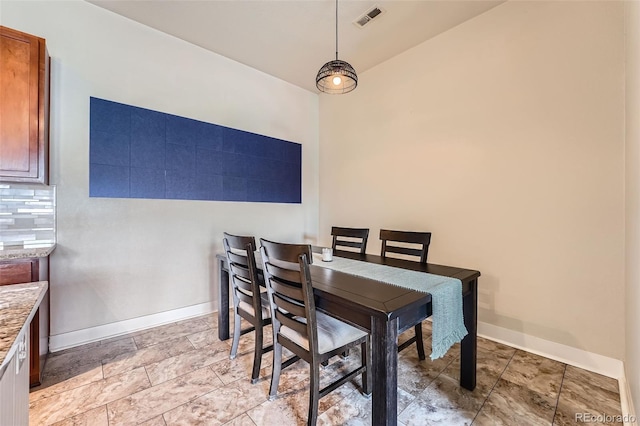 dining room with visible vents and baseboards