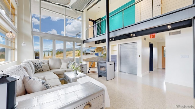 living room featuring a high ceiling