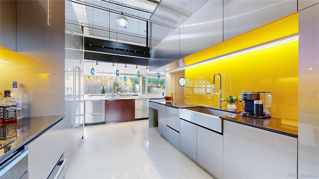 kitchen with sink and a high ceiling