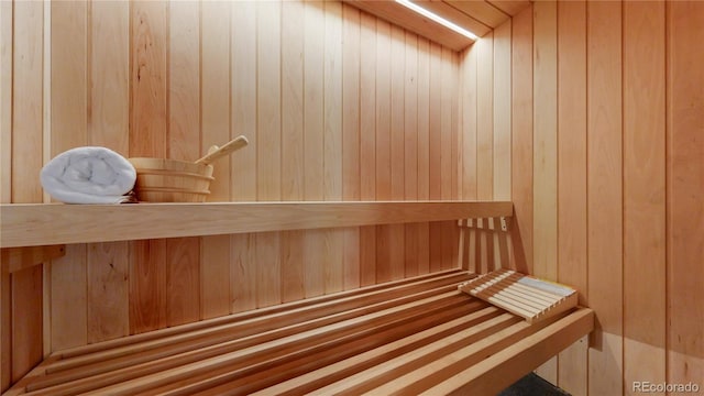 view of sauna / steam room with wooden walls