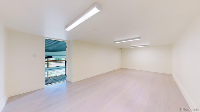 spare room featuring light hardwood / wood-style floors