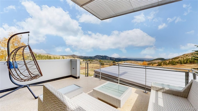 balcony featuring a mountain view