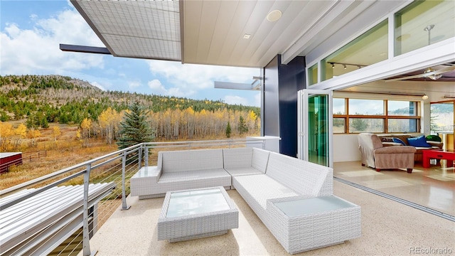 view of patio / terrace with an outdoor living space and a balcony