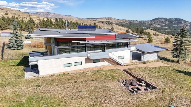 birds eye view of property featuring a mountain view