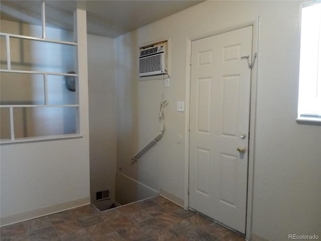 laundry room with a wall mounted AC