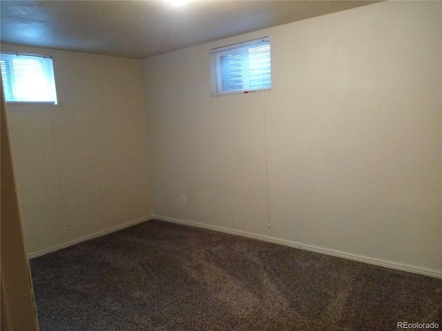 basement with dark colored carpet