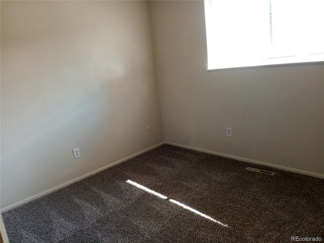 unfurnished room with carpet flooring