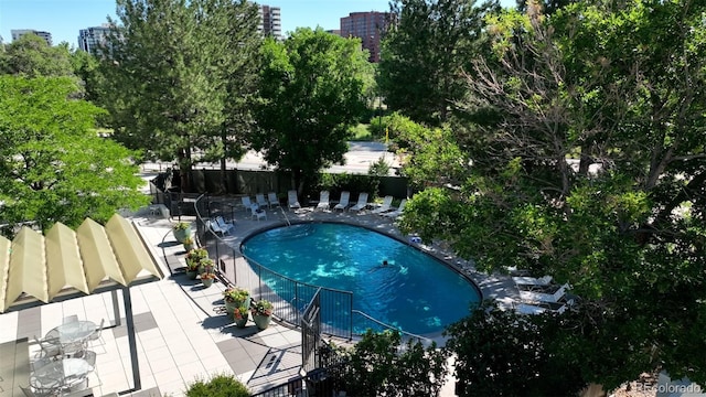 pool featuring a patio and fence