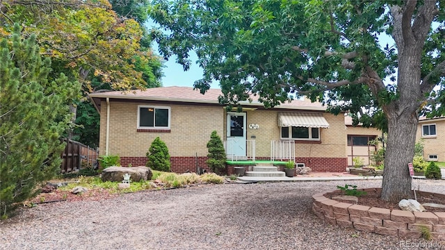 4420 Teller St, Wheat Ridge, CO 80033 - ranch-style home featuring brick siding and a shingled roof