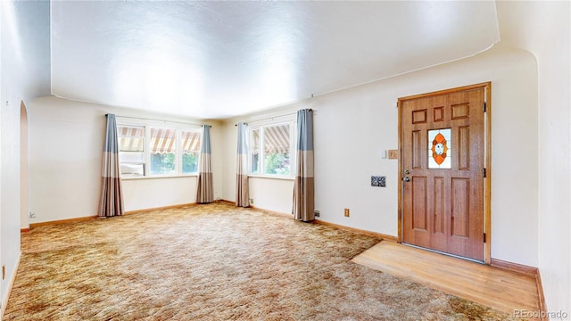 4420 Teller St, Wheat Ridge, CO 80033 - foyer entrance featuring carpet and baseboards