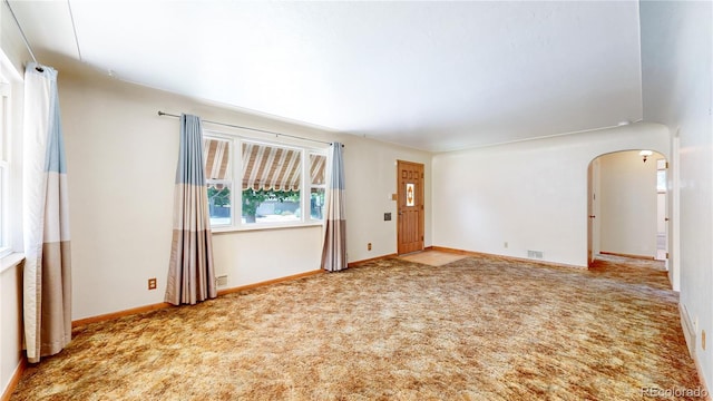 4420 Teller St, Wheat Ridge, CO 80033 - empty room with arched walkways and carpet