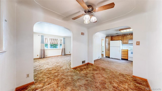 4420 Teller St, Wheat Ridge, CO 80033 - carpeted empty room featuring arched walkways and a ceiling fan