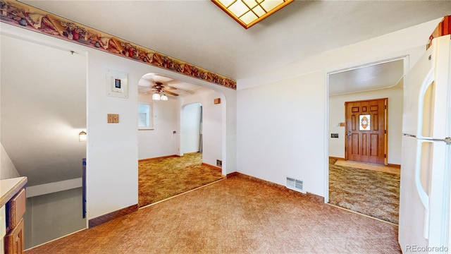 4420 Teller St, Wheat Ridge, CO 80033 - unfurnished room featuring carpet floors, arched walkways, and a ceiling fan