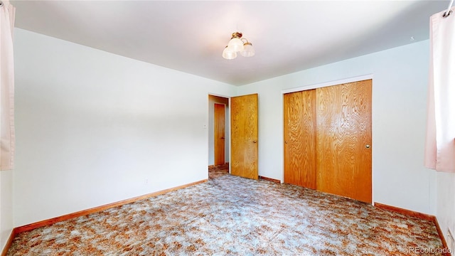 4420 Teller St, Wheat Ridge, CO 80033 - unfurnished bedroom featuring carpet floors and a closet