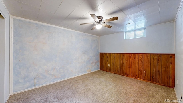 4420 Teller St, Wheat Ridge, CO 80033 - empty room with carpet flooring, wood walls, a ceiling fan, and a wainscoted wall