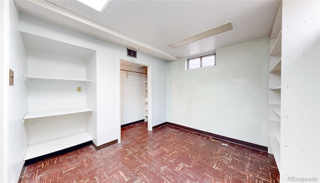4420 Teller St, Wheat Ridge, CO 80033 - unfurnished bedroom featuring dark flooring and a closet